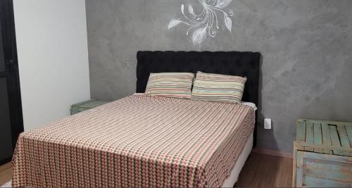 Llit o llits en una habitació de CASA AZUL São Pedro