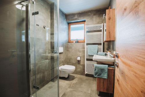 a bathroom with a toilet and a sink and a shower at Appartement Stern Dagmar in Neustift im Stubaital