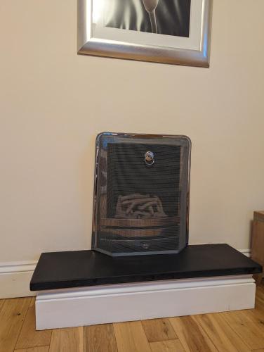 a suitcase sitting on top of a table at Unbeatable Llanberis Location, Detached with Parking, Snowdon Views. in Llanberis