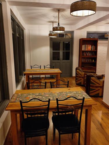 a dining room with a table and chairs at Ziran retreat in Mukteswar