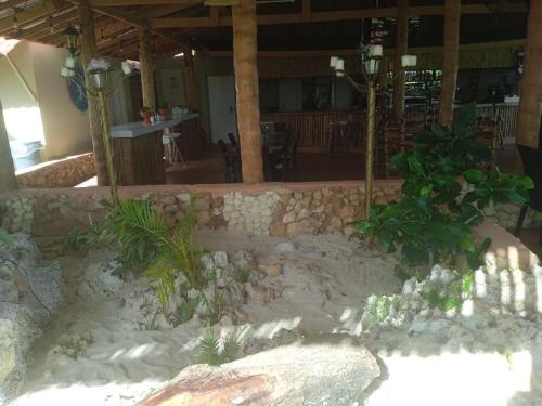 a sand garden in a building with a restaurant at Arena Oceanview Hotel & La Terraza Restaurant in Las Galeras