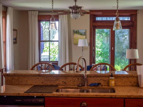 a kitchen with a sink and some windows at Wren Retweet in Chestertown