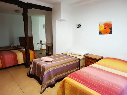 Postel nebo postele na pokoji v ubytování Corrala de San Antón. Sencillo apartamento en pleno centro