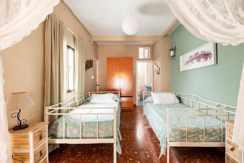 Säng eller sängar i ett rum på Casa Mundial Jerez