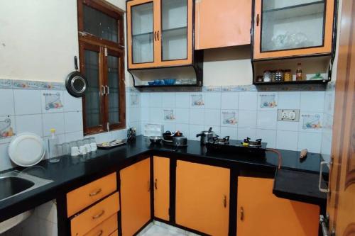 a kitchen with a sink and a counter top at Yash's Congenial stays - 1 Rk independent place. in Lucknow