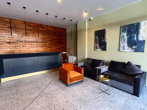 a living room with two couches and a chair at Delux apartment for 6 guest, new gudauri in Gudauri