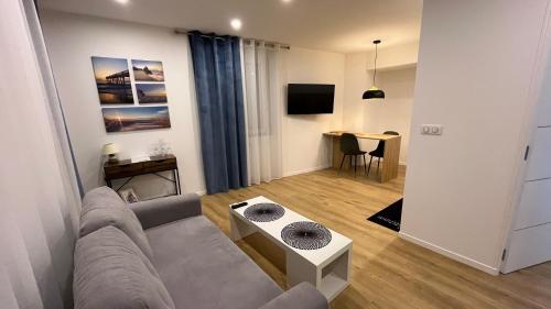 Televisyen dan/atau pusat hiburan di Appartement Luxe Jaune