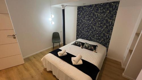 Katil atau katil-katil dalam bilik di Appartement Luxe Jaune