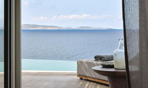 a view of the ocean from a hotel room at Amazon Mykonos Suites & Spa in Agios Ioannis Mykonos