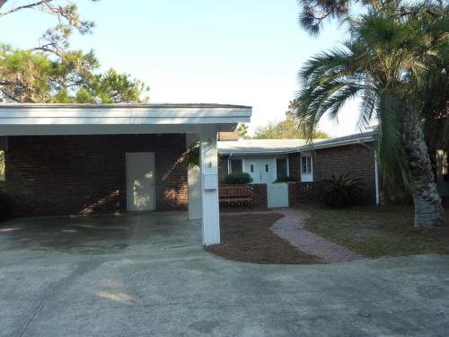 A BEACHFRONT PALM HOUSE home