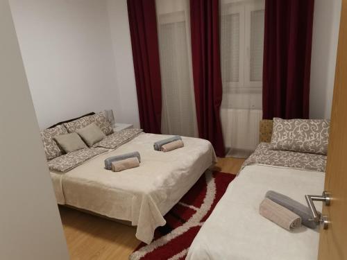 Postel nebo postele na pokoji v ubytování Apartman Stojanović
