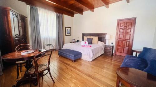 Кровать или кровати в номере Hotel & Hacienda La Caravedo