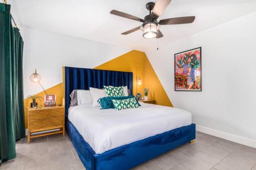 a bedroom with a bed with a ceiling fan at Groovy Old Town Scottsdale Condo in Scottsdale