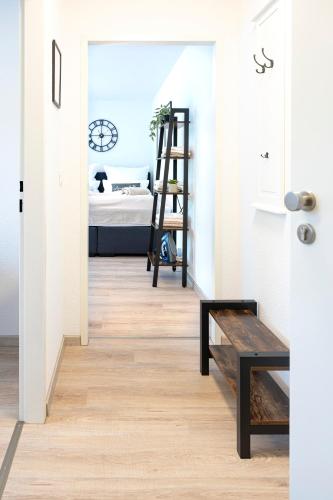 a hallway with a stairs leading to a bedroom at Business Apartment für 2 - Küche - Parkplatz - Netflix in Crailsheim
