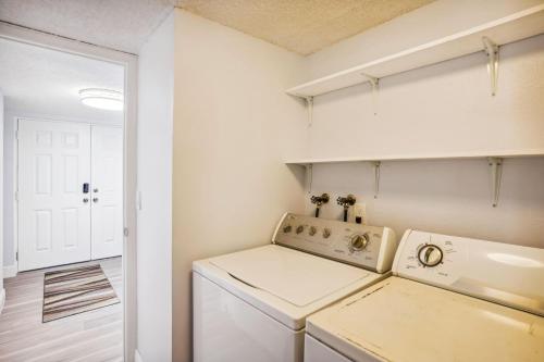 a laundry room with a washer and dryer at Madeira Vista 601 in St Pete Beach