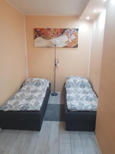 Llit o llits en una habitació de Apartament W2, Mieszkanie dla Wszystkich