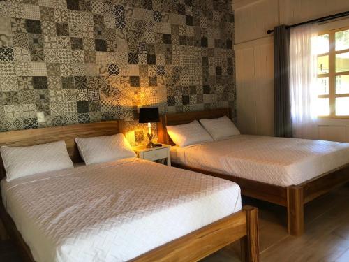 Cama ou camas em um quarto em Hotel Villas Gaia Ecolodge