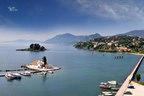 a view of a body of water with boats in it at Alex Apartment Suites in Virós