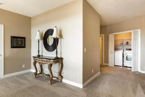 a room with a table and a mirror on a wall at Cedar House Retreat in Excelsior
