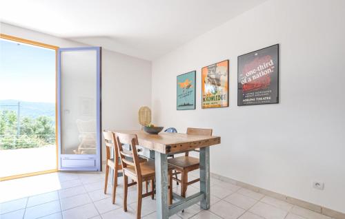 a dining room with a wooden table and chairs at Cozy Home In Bargemon With Wifi in Bargemon