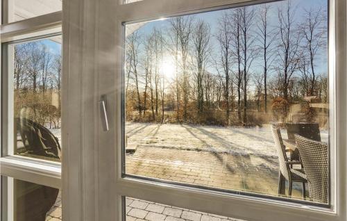 an open window with a view of a yard at Holiday Home Toftlund With A Fireplace 09 in Arrild