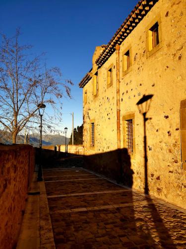 an old building with a street light next to it at Al Convento in San Mauro Castelverde