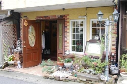 a house with a door and some plants in front of it at Otsu - House / Vacation STAY 2968 in Otsu