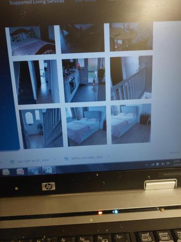 un écran pour ordinateur portable avec une photo d'un salon dans l'établissement Diamond accommodation, à Londres