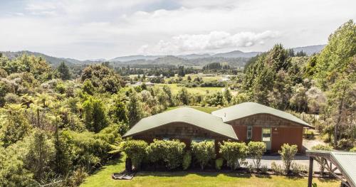 an aerial view of a house in the mountains at Goldfield Suites in Greymouth