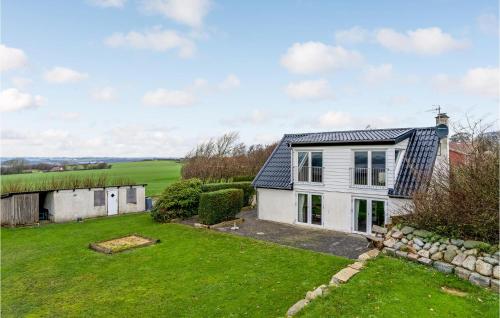an exterior view of a house with a yard at Nice Home In Erslev With Wifi in Erslev
