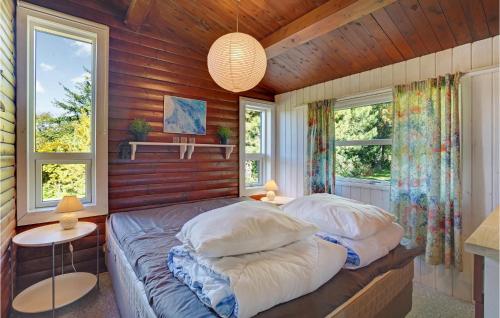 a bedroom with two beds and two windows at Stunning Home In Nykøbing Sj With Wifi in Klint