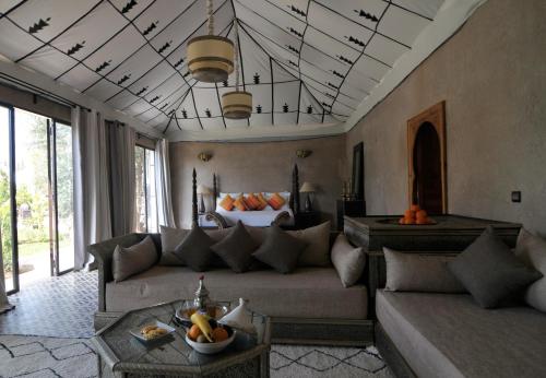 a living room with a couch and a table at Riad Jawad & Spa in Marrakech