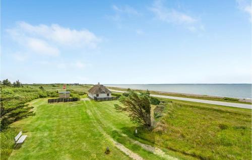 an aerial view of a house and the ocean at Gorgeous Home In Thyholm With Kitchen in Thyholm