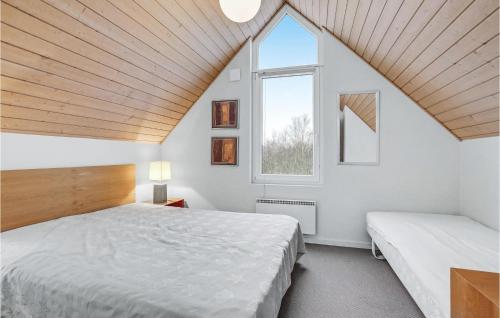 a bedroom with two beds and a window at Cozy Home In Nrre Nebel With Kitchen in Nørre Nebel