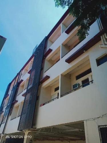 a building with balconies on the side of it at WJV INN CONSOLACION in Consolation