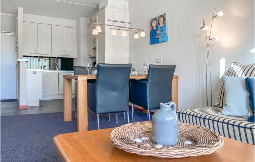 a kitchen and living room with a table and chairs at 2 Bedroom Lovely Home In Bruinisse in Bruinisse
