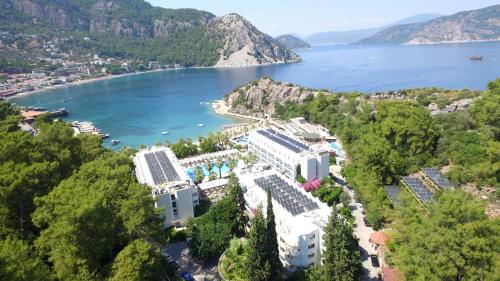 an aerial view of a resort next to a body of water at Turunc Resort Hotel in Turunc