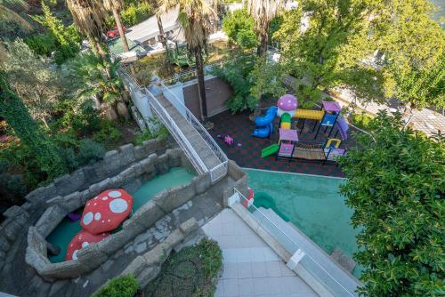 an overhead view of a pool with a playground at Turunc Resort Hotel in Turunc