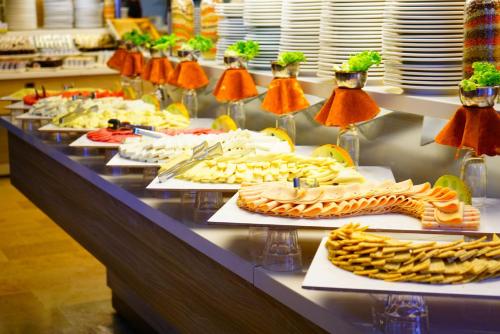 a buffet with many plates of food on a table at Turunc Resort Hotel in Turunc