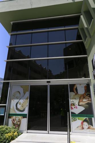 a building with windows with pictures of people on them at Turunc Resort Hotel in Turunc