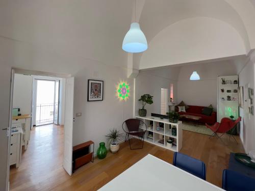 a living room with a couch and a table at Q40 Ostuni in Ostuni