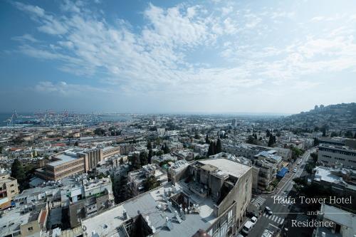 an aerial view of a city with buildings at Haifa Tower Hotel - מלון מגדל חיפה in Haifa