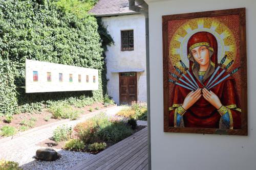 a painting of a woman on the side of a building at Appartement ROSalia in Forchtenstein