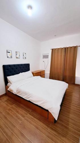 Postel nebo postele na pokoji v ubytování Night Blink Staycation And Rentals