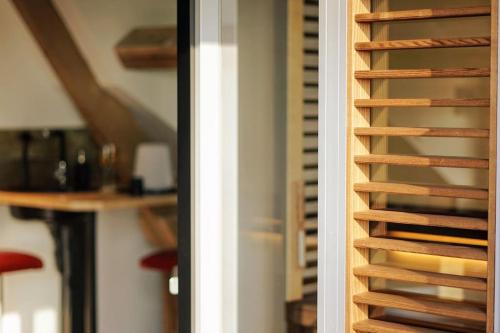 a close up of a wine rack in a room at Spa privatif à la ferme - Haut de gamme - Atypique in Bois-Grenier