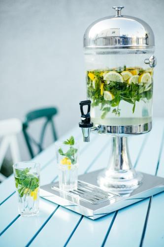 a food processor with drinks on a table at Domus Bat Galim Hotel in Haifa