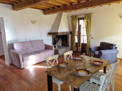 a living room with a table and a couch at Podere Vecci in Dicomano