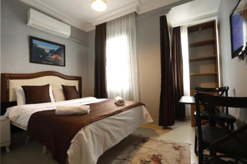 a bedroom with a large bed and a window at Hotel 61 istanbul in Istanbul