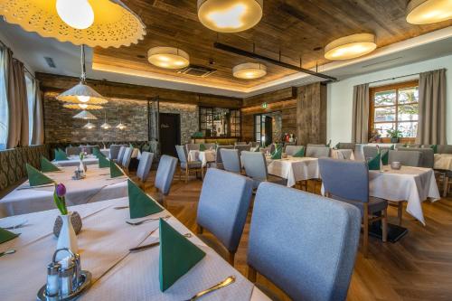 a large dining room with tables and chairs at Brückenwirt in Hallein