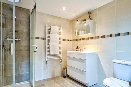 a bathroom with a shower and a toilet at Luxury Studio Suite in Stamford Centre - The Old Seed Mill - A in Stamford